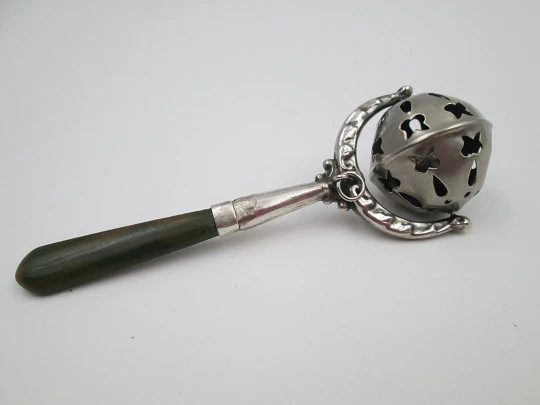 Baby rattle with handle. Sterling silver & bitone resin. Sphere with drops and butterflies