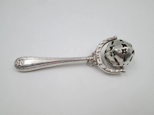 Baby rattle with handle. Sterling silver. Vegetable motifs. Openwork sphere. 1980's