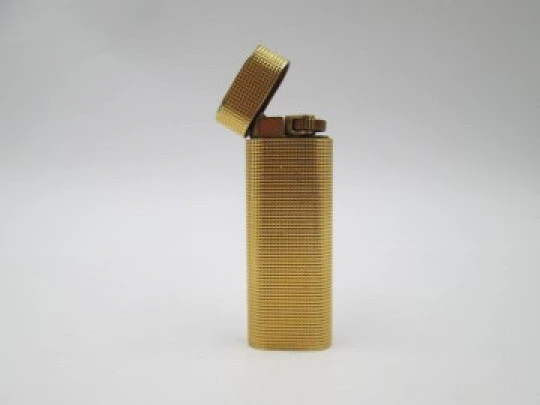 Cartier Paris butane lighter. Rhomboid decoration. Rolled gold. Swiss. 1990's