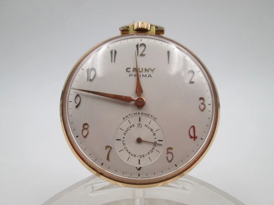 Cauny Prima. Gold plated metal. Manual wind. Small seconds hand. Ornate back. 1960's