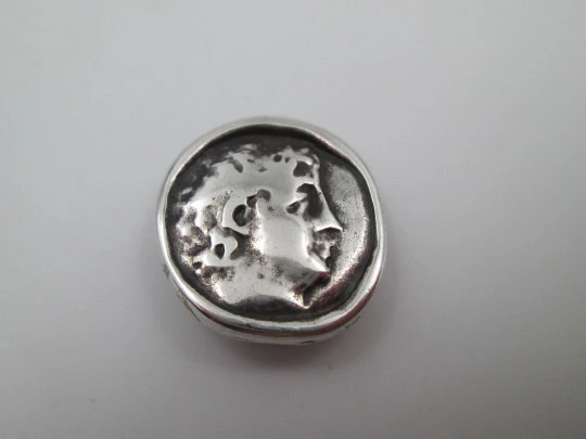 Circular pendant for ribbon. Sterling silver. Greek bust relief. Europe. 1930's