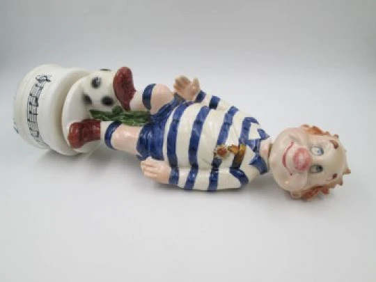 Football player wind-up musical bottle. Melody & movement. Polychrome ceramic