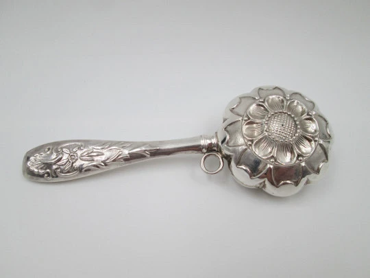 Hand baby rattle. 925 sterling silver. Floral and vegetable motifs. Ring on handle. Spain. 1990's