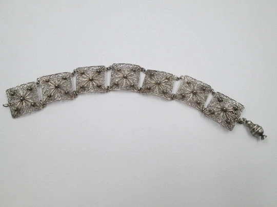 Ladie's articulated filigree bracelet. Sterling silver. Flowers & spheres motifs. Spain. 1950's