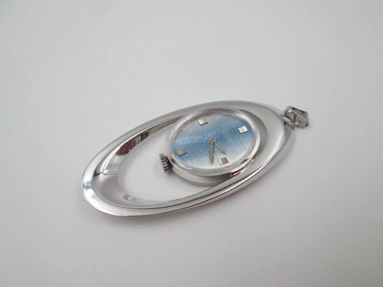 Mortima pendant watch. Silver plated metal. Bitone dial. Elliptical shape. France. 1970's