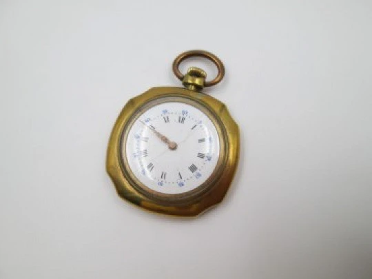 Open-face swiss pocket watch. Octogonal case. Gold plated metal