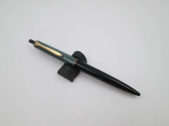 Pelikan 355 ballpoint pen. Green & black striped resin. Gold plated details. Push button