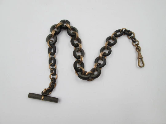 Pocket watch decreasing links chain. Gold plated and hard rubber. T-Bar. Europe. 1890's