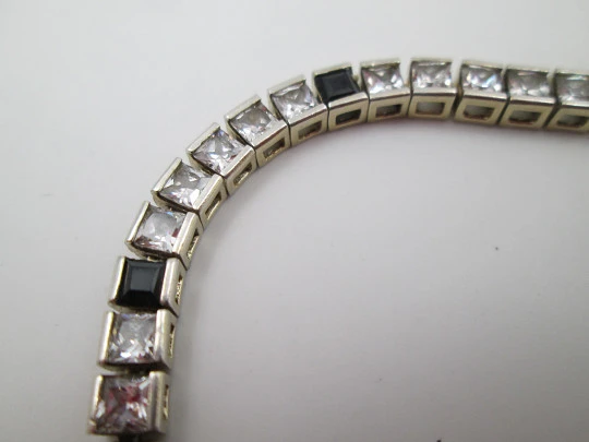 Riviere bracelet. Sterling silver & vermeil. White sapphires and blue gems. 1980's