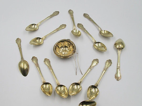 Set twelve dessert spoons & tea strainer. 800 vermeil silver. 1900's