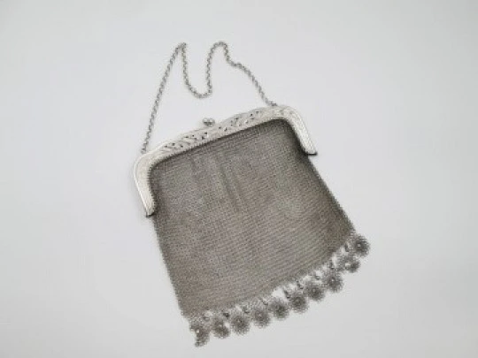 Sterling silver mesh bag. Openwork clutch frame. Vegetable motifs. Europe. 1920's