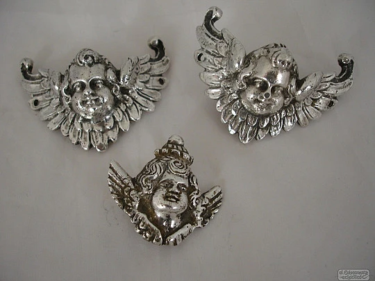 Three ancient apliques. Winged cherubs. Silver. 18-19th centuries