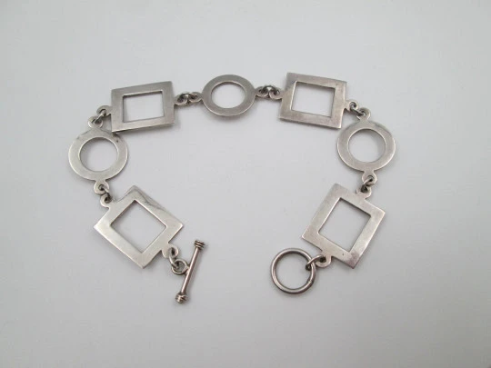 Women's bracelet. 925 sterling silver. Circle and square motifs. Ring and T bar clasp. 1980's